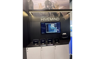 Staff photo of Hivemind display at Shield AI booth S5-306 at DSEI UK 2025.