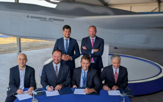 Executives signing MOU via General Atomics
